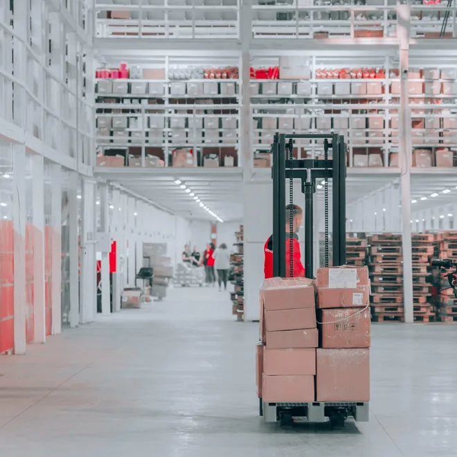 Warehouse aisles stacked with cartons